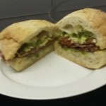 Ciabatta with cured meat, cheese and pesto