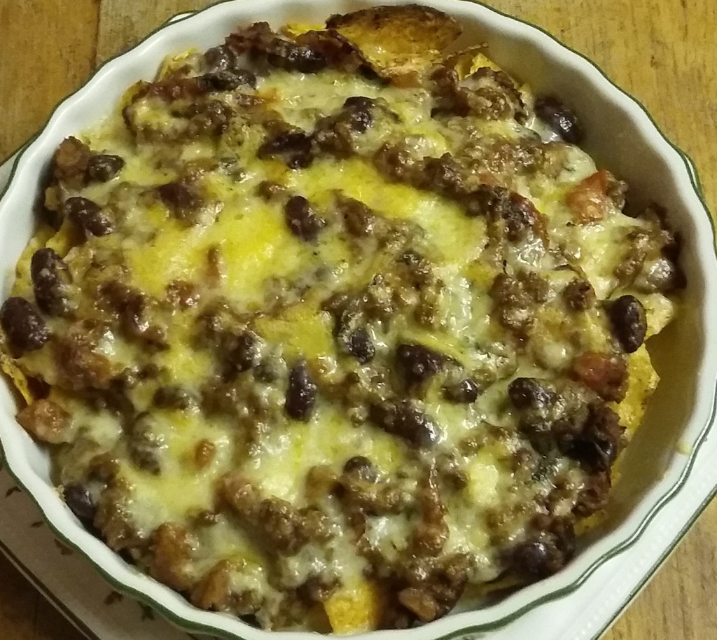 Chilli with tortilla chips and cheddar cheese, heated under the grill